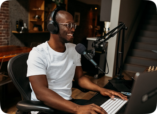 Creator in studio with headphones and microphone